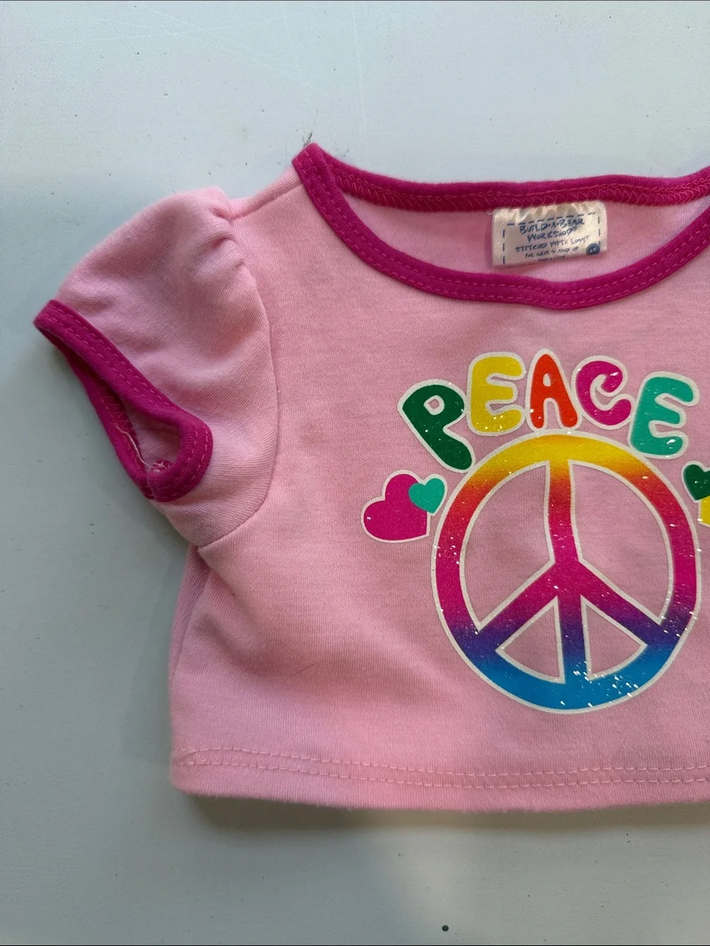Build-a-bear pink peace sign shirt